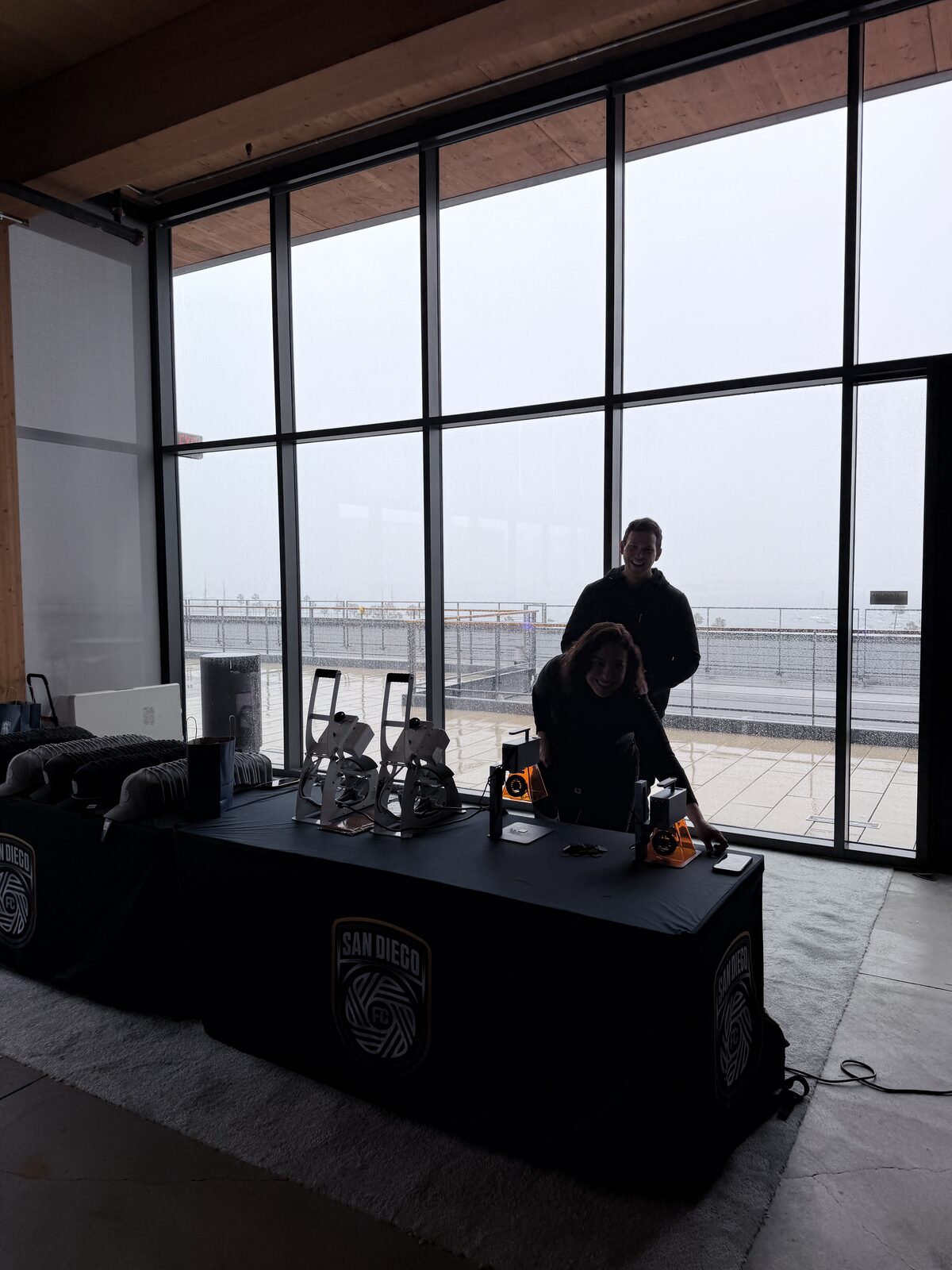 An elevated view of a live screen-printing activation drawing a crowd at a New York convention-style event